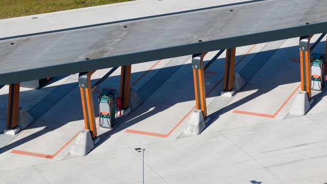 Zwolle, Netherlands - 23 April 2026: Aerial view of Milence Charging Hub Zwolle featuring a large modern canopy with wooden pillars and electric vehicle charging stations under bright sunlight.