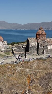 Vertical aerial footage of monastery overlooking Lake Sevan, Armenia