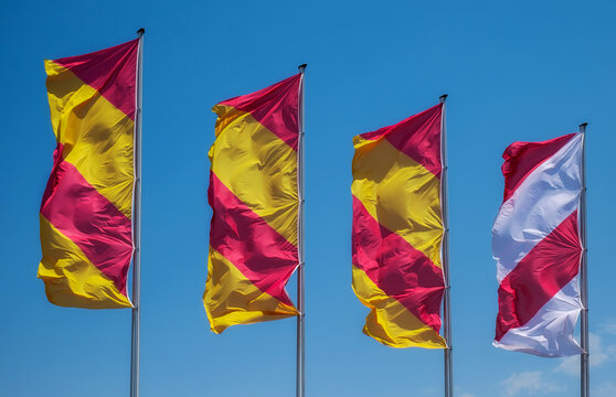 flags waving in the wind against blue sky