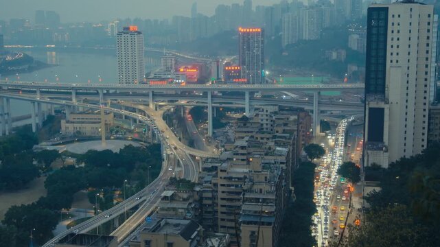 Chongqing Multi Level Highway Interchange with Metro Train and Dense City Traffic at Dusk (3)