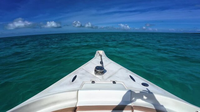 Experience the ultimate freedom of navigating crystal-clear Caribbean waters towards a pristine tropical horizon.