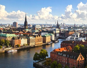 Fototapeta premium A scenic urban view, showcasing a river winding through a bustling city with notable church spires piercing the skyline under a sunny sky