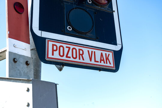Railway warning sign Pozor vlak on signal pole close up  railway station Vrbatky, Czech Republic - May 3, 2026 Zeleznicni stanice, vlakova zastavka Nadrazi
