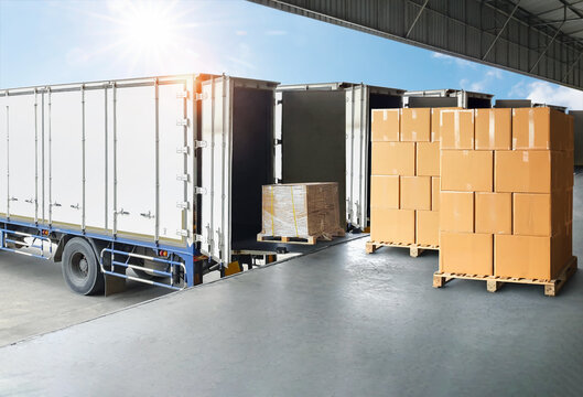 Bulk of package boxes shipment. Goods awaiting loading into containers trucks. Carton, CardBoard Boxes. Distribution Warehouse, Shipping Cargo Container. Freight Transportation,Truck Logistics.	
