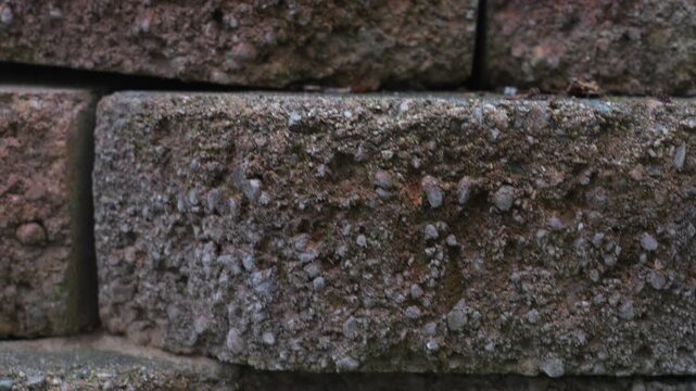 Pedestal motion up showing the rows of red Garden bricks.