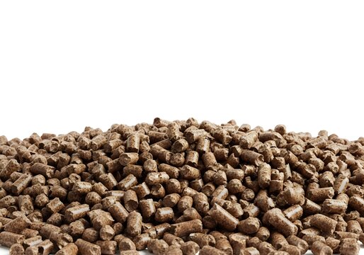 A generous mound of uniform brown pelletized feed material, suggesting agricultural sustenance for livestock or animal husbandry purposes, filling the lower frame