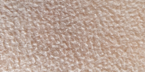 Soft beige terry cloth texture, macro view of fluffy cotton towel fabric, neutral cream textile background for spa and wellness branding © Arbaz