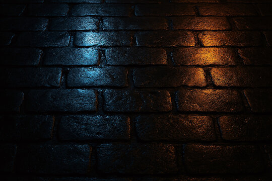 Wet dark brick pavement with blue and orange light reflections