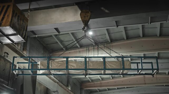 Monitoring Tension And Guiding Equipment To Accurately Position Heavy Items Safely Into Pallet Area