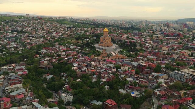 aerial Holy Trinity Cathedral of Tbilisi (Sameba) at sunset. cityscape skyline Downton capital city of Georgia 