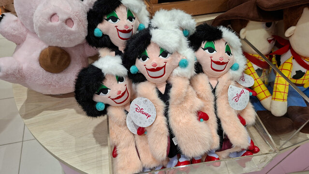 Row of Cruella de Vil plush dolls from One Hundred and One Dalmatians movie displayed on a retail shelf on May 9, 2026 in Bangkok, Thailand.