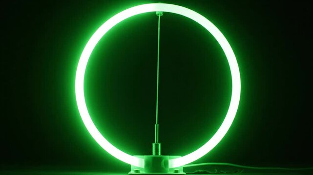 Glowing Green Ring Light Standing on Dark Background
