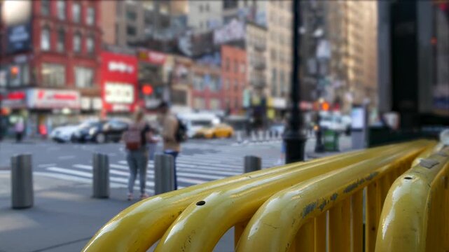 Manhattan Midtown street New York City, United States. Crossroad near Port authority bus terminal. Defocused car traffic on urban road, 8th avenue in Hells Kitchen. People pedestrian, yellow taxi cab.