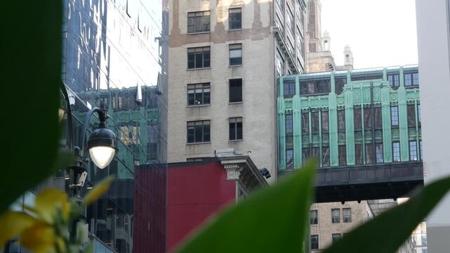 New York City Gimbels bridge, Manhattan Midtown, United States of America. Skybridge on Broadway, Herald Square, USA. Gimbels traverse on 6 avenue. Historic elevated walkway 1925, copper green patina.