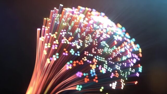 Slow motion tracking shot of fiber optic cables glowing and shimmering in dark studio closeup with colorful bokeh lights and flowing strands