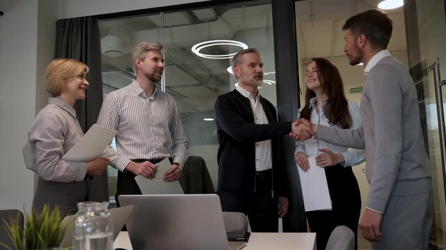 Business people shaking hands, finishing up a meeting