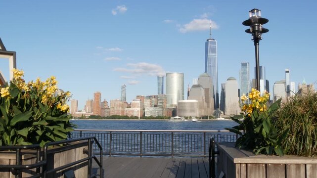 New York City Manhattan downtown financial district skyline, New Jersey Exchange Place, United States. Urban cityscape with skyscraper buildings, World Trade Center. J Owen Grundy park, Paulus Hook.