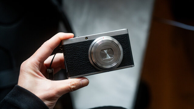 Hand Holding Compact Film Style Camera Close Up