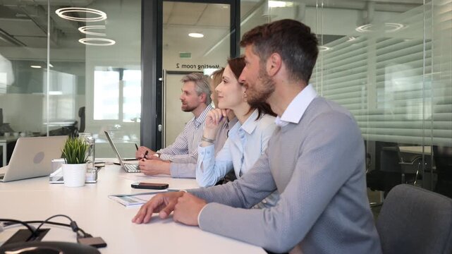 Business meeting - manager discussing work with his colleagues.