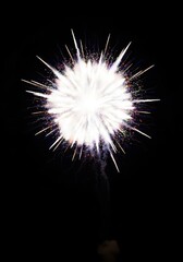 Obraz premium Intense bright white explosion illuminating the dark night sky. Sudden high energy flash from a colorful pyrotechnic display, powder, abstract background, pattern