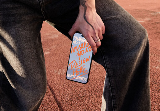 Smartphone Screen Held in Hand. PSD template mockup.