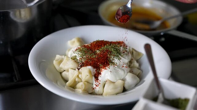 Adding Red Pepper Spice to Traditional Turkish Mantı