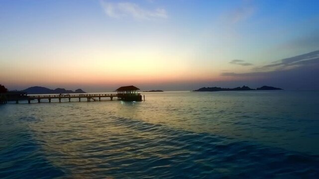 Beach waves during blue hour at the Redang Island jetty, Malaysia.