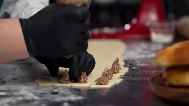 Chef Filling Handmade Turkish Manti with Meat