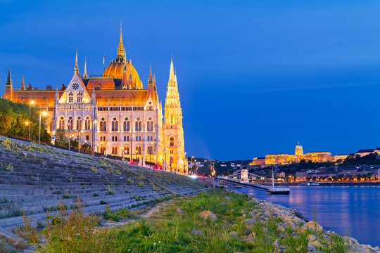 Budapest Parliament building by the river at night