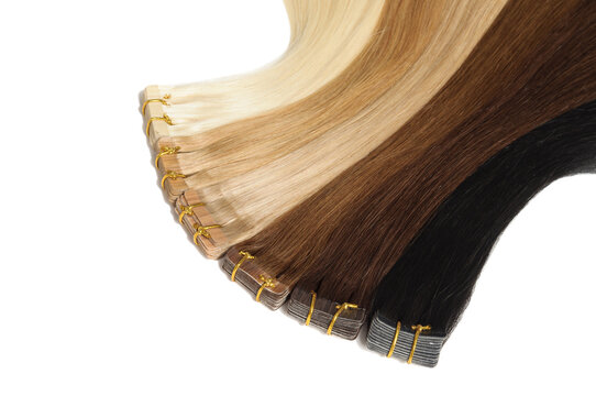 closerup of various colors of straight tape in human hair extensions