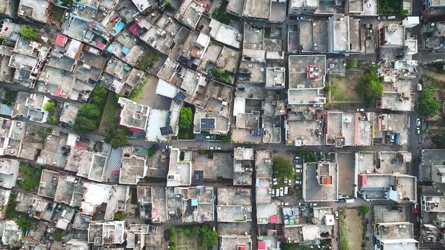 Top-down aerial abstract of dense residential rooftops in Jammu India.
