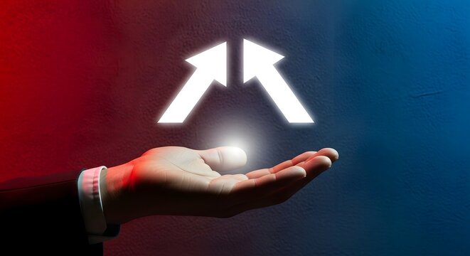 A person in a dark suit holding a glowing white upward pointing arrow with a bright light effect against a split red and blue textured wall background