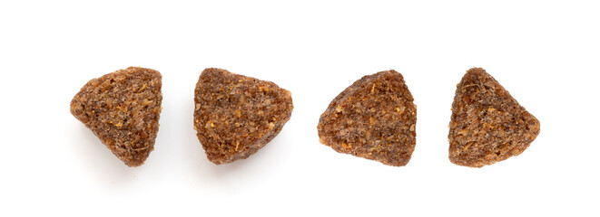 Dry pet food macro pieces isolated, cat kibble closeup, dog pellets, small protein croquettes © ange1011