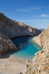 The empty, small and picturesque Seitan Limania Beach at the end of a narrow fjord in Crete, Greece, on sunny day. © tuomaslehtinen