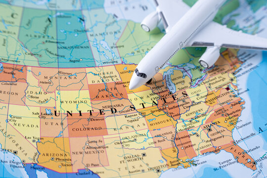 Airplane over United States map showing transatlantic travel and destination