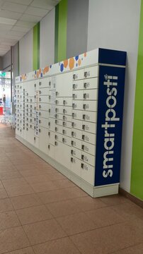 Vilnius Lithuania 02.04.2026 Smartpost parcel locker terminal in shopping center corridor with automated package boxes and modern contactless delivery service technology concept