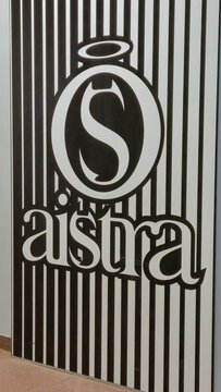 Vilnius Lithuania 02.04.2026 Aistra intimate goods boutique illuminated wall logo with striped monochrome design inside modern shopping mall retail interior concept
