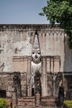 The ancient mandapa housing Phra Achana, the giant seated Buddha at Wat Si Chum, Sukhothai, Thailand.