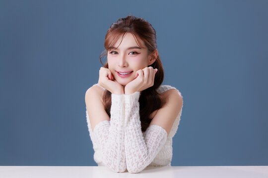 Young Asian Beauty Woman with Korean Makeup, Glossy Lips and Soft Blush Look.