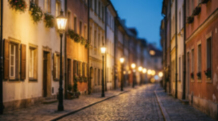 Fototapeta premium Old european street at night with glowing lanterns and cobblestone road