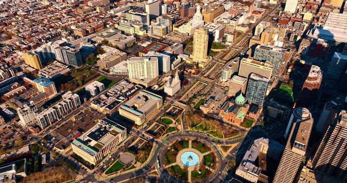 Vast urban panorama of Philadelphia, Pennsylvania, USA. Drone footage approaching Logan Square with lively traffic.