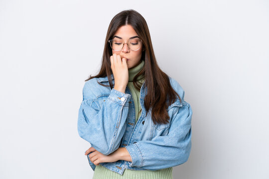 Young Brazilian woman isolated on white background having doubts