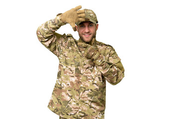 Fototapeta premium Military man over isolated chroma key background focusing face. Framing symbol