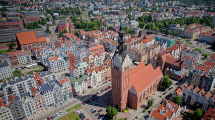 Naklejka premium Aerial view of Elbląg Old Town with St. Nicholas Cathedral, historic architecture and urban skyline, Poland.