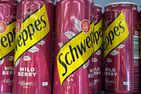 Wroclaw, Poland, April 18, 2026: Schweppes Wild Berry Cans Display - Refreshing Beverage Marketing Design