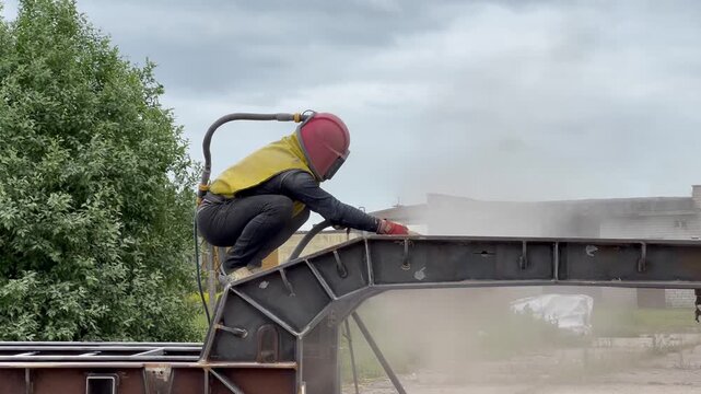man with sandblaster