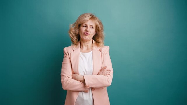Unhappy and resentful mature woman looking with contempt and indignation. Senior lady expressing negative emotions, feeling disgusted
