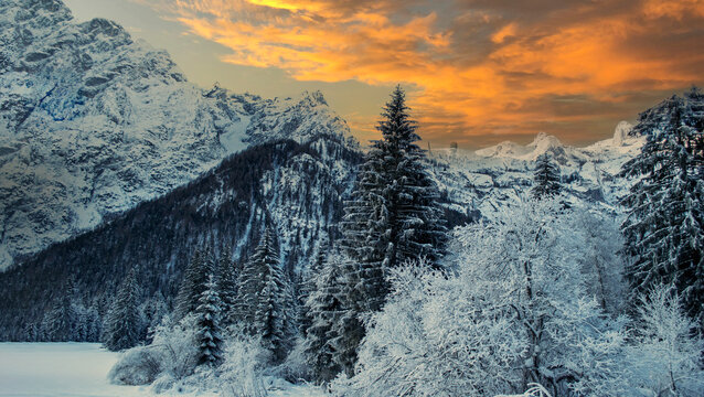 a polar cold and a beautiful winter scene with the sunset behind the mountains