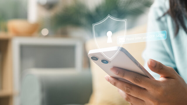 User holding smartphone with security shield and OTP code interface, representing two factor authentication, login protection, mobile cybersecurity and secure digital identity verification.