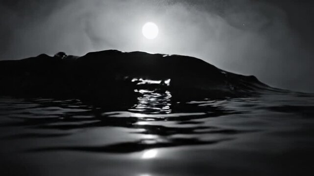 Black and white dramatic ocean wave breaking in the moonlight with water reflection, a cinematic scene
